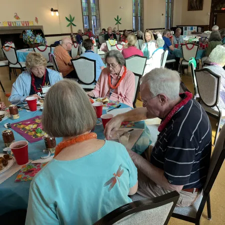 a group of people sitting at tables