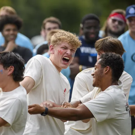 a group of people in white shirts