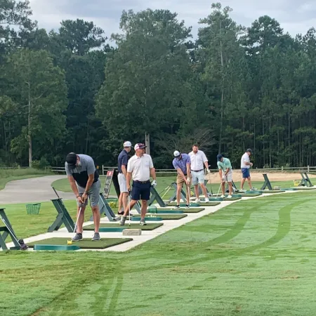 a group of people playing golf