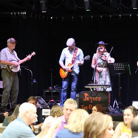 a group of people on a stage with musical instruments