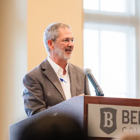 a man speaking at a podium