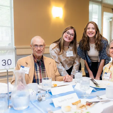 a group of people sitting at a table