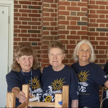 a group of women posing for a photo