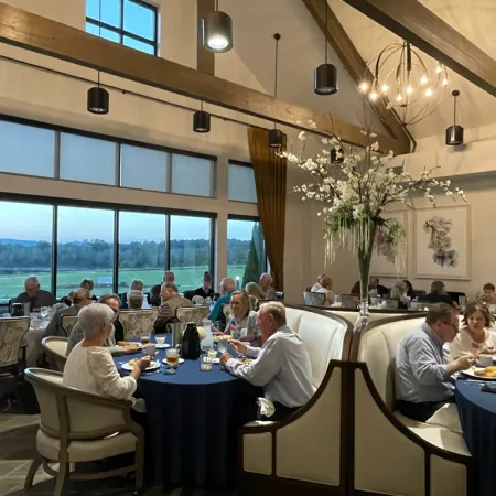 a group of people sitting at tables