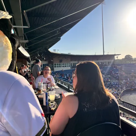 a group of people at a baseball game