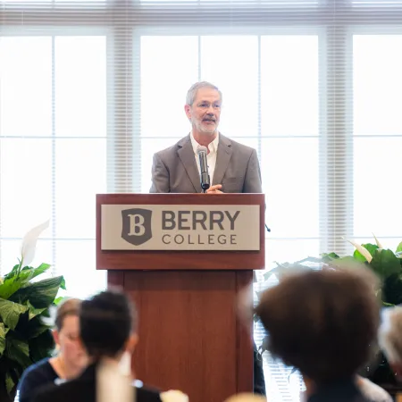 a person standing at a podium