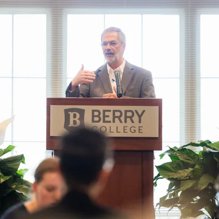 a man standing at a podium