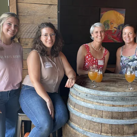 a group of women posing for a photo