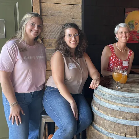 a group of women posing for a photo