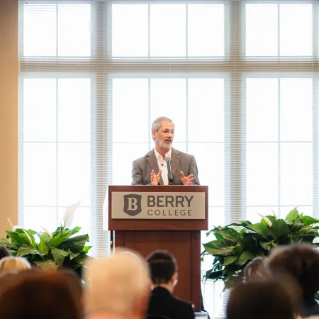 a person standing at a podium