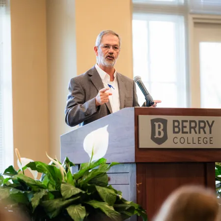 a person standing at a podium