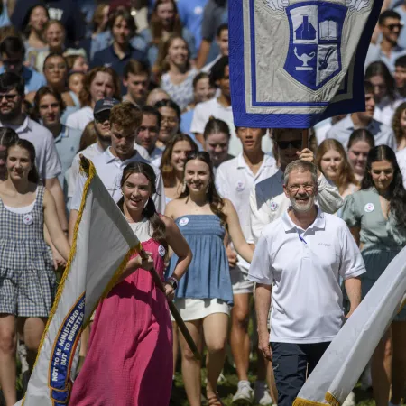 a crowd of people holding flags