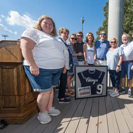 a group of people standing on a deck