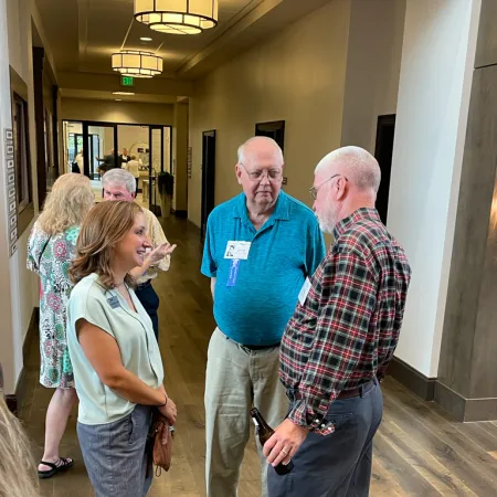 a group of people standing in a hallway