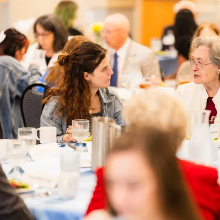 a group of people sitting at tables