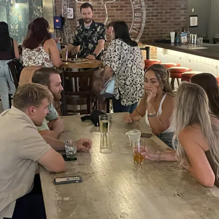 a group of people sitting at a table