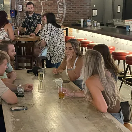 a group of people sitting at a table