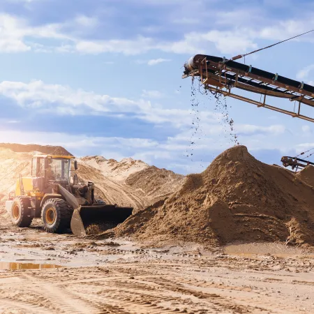 a construction vehicle on a dirt road