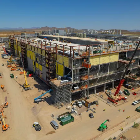 a construction site with cranes and vehicles