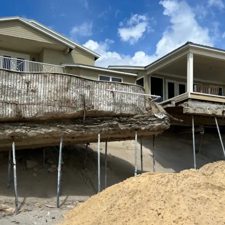 a house being built on a beach