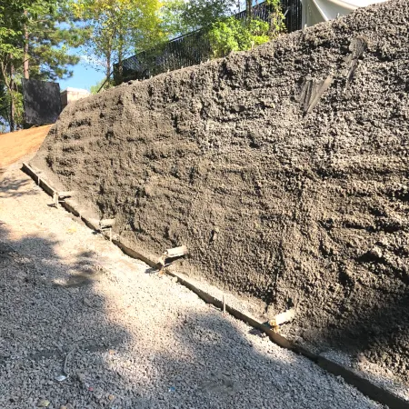 Cantsink helical piles retaining wall