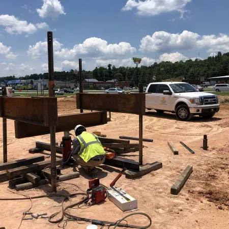 a couple of men working on a construction site