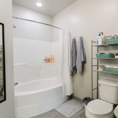 a bathroom with a shower and toilet