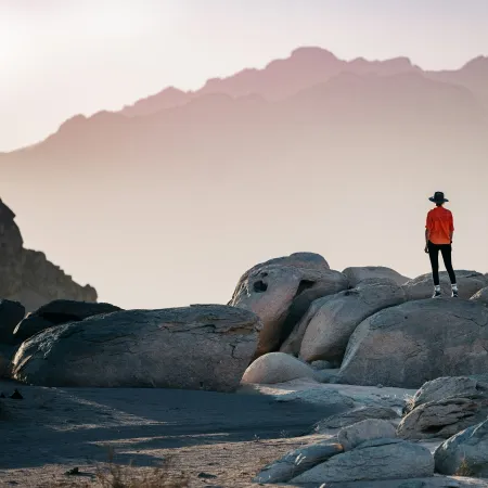 a person standing on a rock