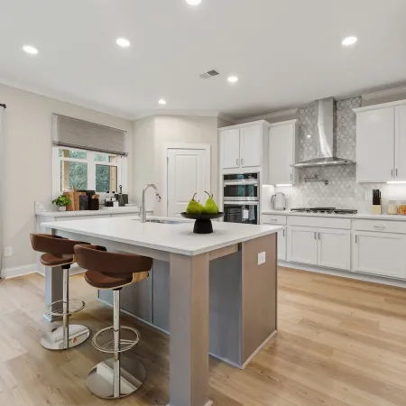 a kitchen with white cabinets