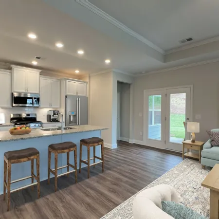 a kitchen with a bar and a couch