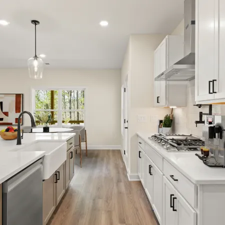 a kitchen with white cabinets