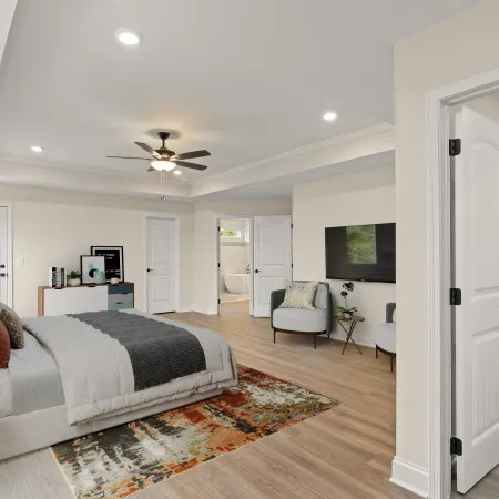a bedroom with a bed and a tv