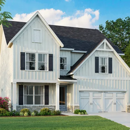 Modern white farmhouse-style two-story home with black shutters, stone accents, and a two-car garage surrounded by trees.