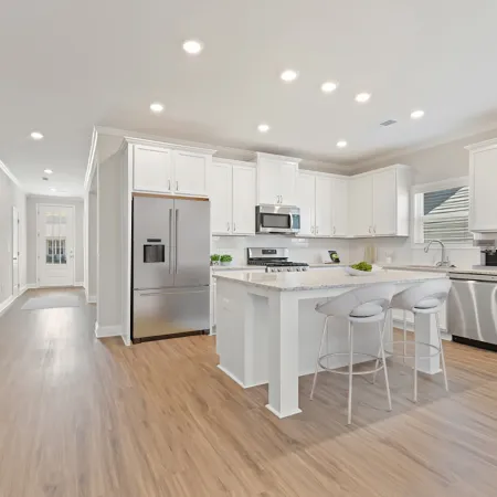 a kitchen with white cabinets