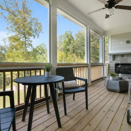 a table and chairs on a deck