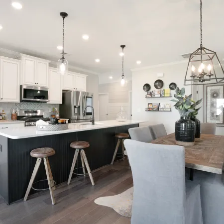 a kitchen with a table and chairs