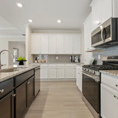 a kitchen with white cabinets