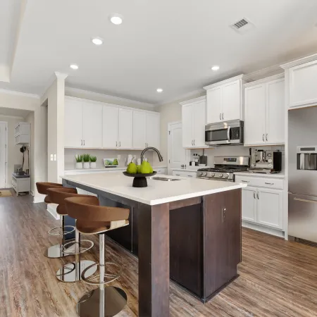 a kitchen with white cabinets
