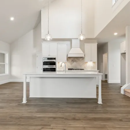 a kitchen with white cabinets