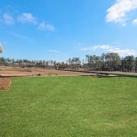 a large green lawn next to a building