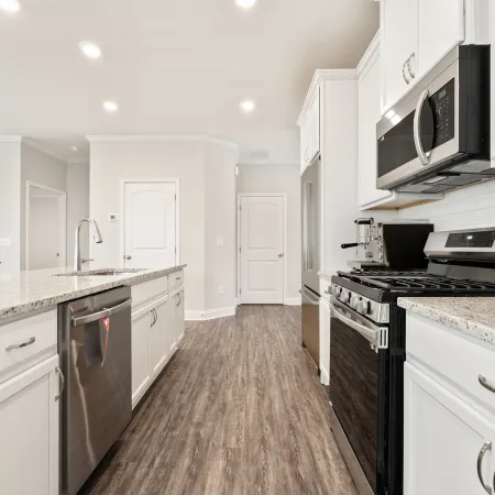 a kitchen with white cabinets