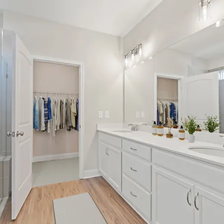 a bathroom with a sink and a shower unit