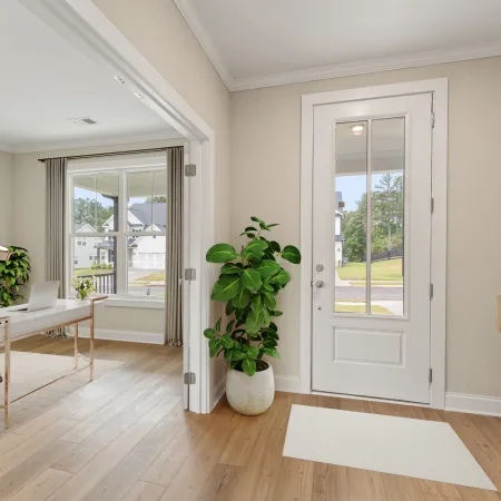 a room with a table and plants