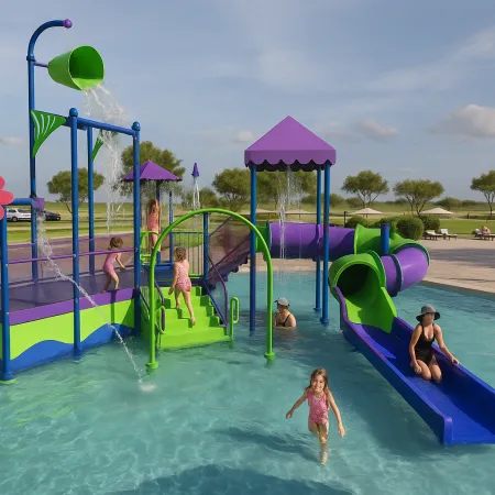 Children playing on colorful water playground with slides and splash features in a shallow pool under sunny sky.