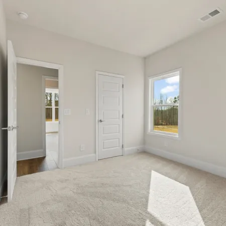 a hallway with white doors