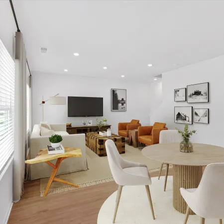 Modern living room with cozy furniture, minimalist decor, and a warm inviting atmosphere.