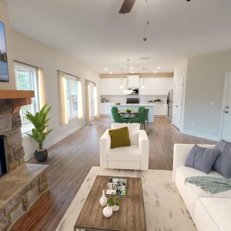a living room filled with furniture and a fire place