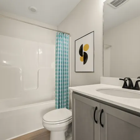 a bathroom with a sink toilet and a shower