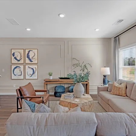 a living room with a couch and chairs