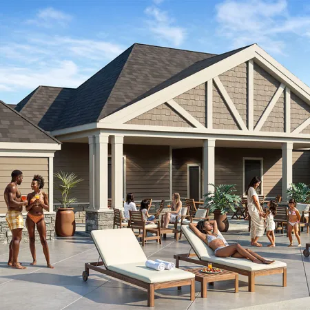 People relaxing and socializing around a poolside with lounge chairs and a modern clubhouse on a sunny day